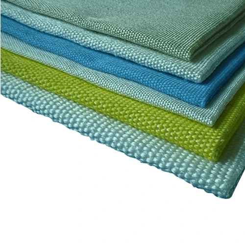 A stack of Termaltex S fabric samples in shades of green and blue, with a visibly woven texture.