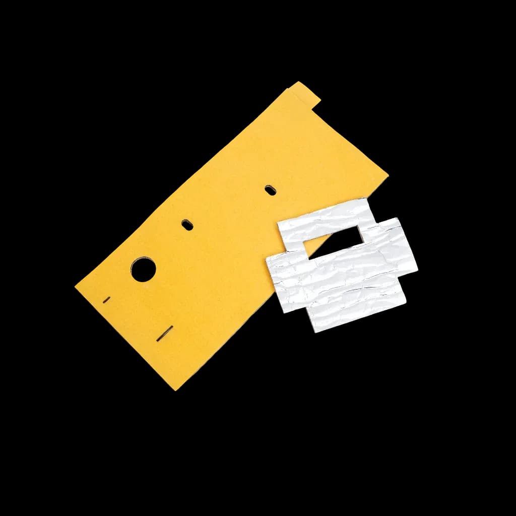A set of Thermshield insulating parts, including a yellow specially shaped board with holes and a white fibrous fragment.