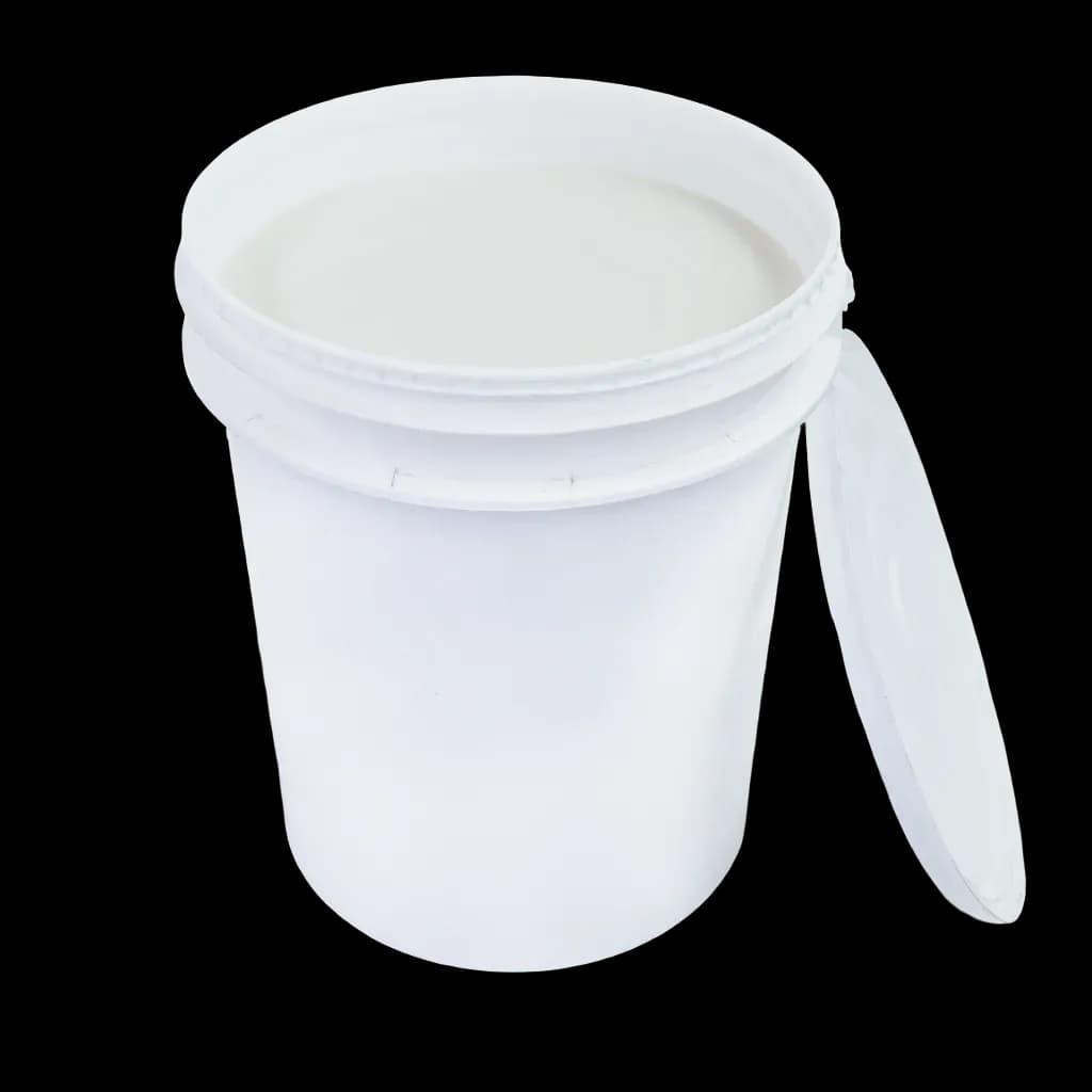 A white plastic container with the lid partially open, containing white Termalcoat refractory compound.